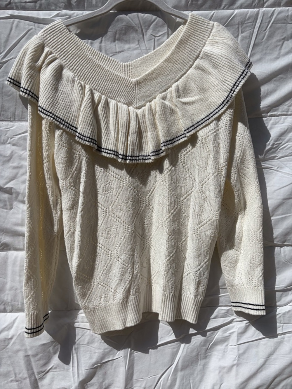 Coach Cream Off-the-Shoulder Ruffle Sweater with Black Trim
